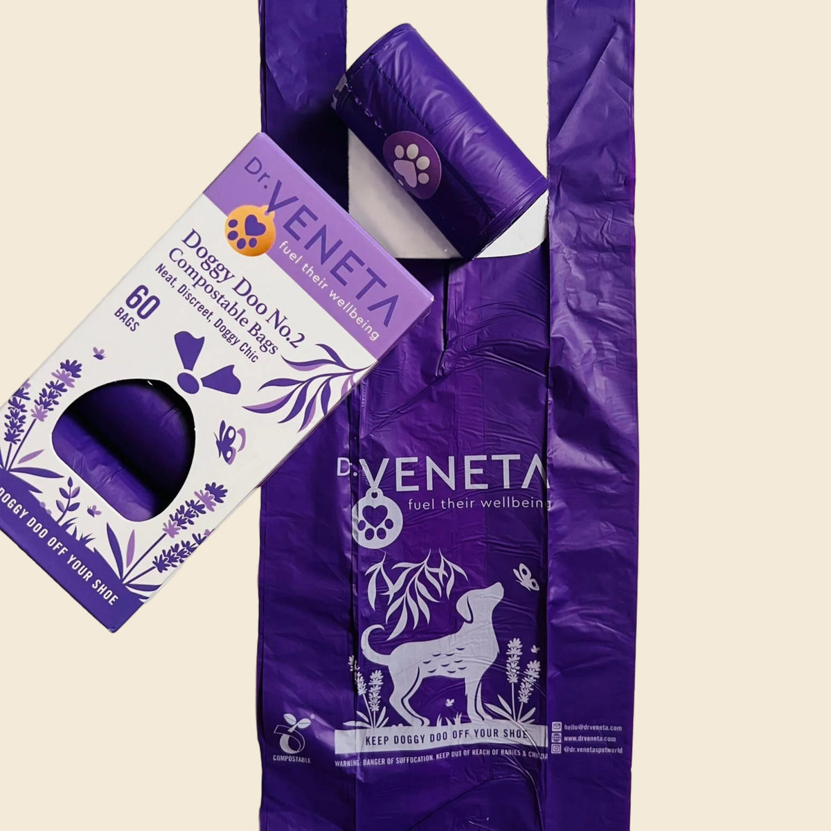 A purple plastic bag with a roll of dog poop bags partially tucked inside, alongside a matching box labeled 'Dr. Veneta Doggy Doo No.