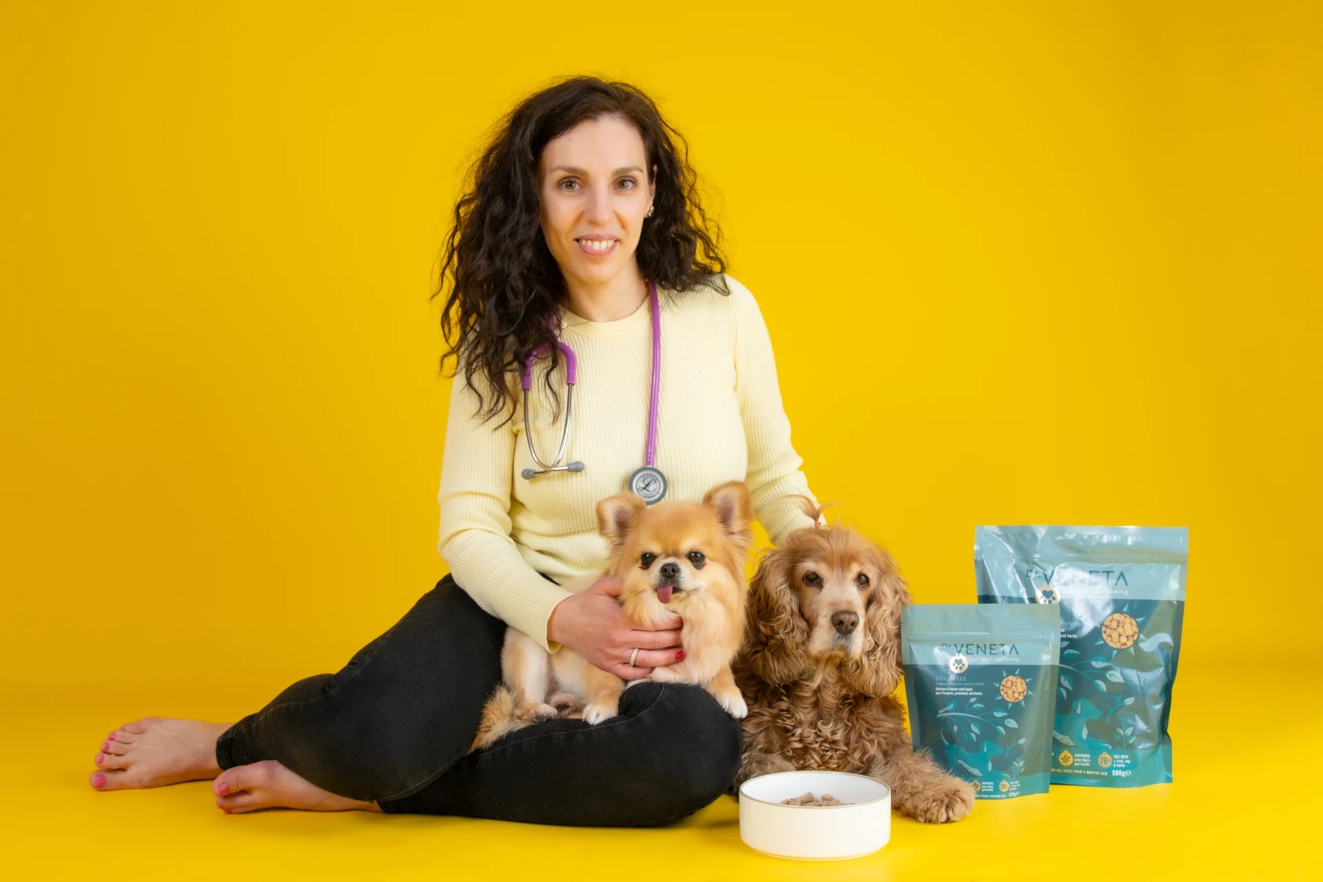 Dr Veneta with dogs and natural pet wellness products