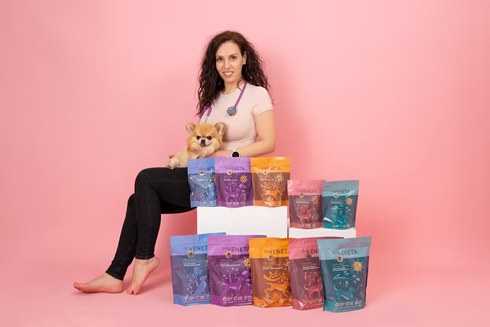 Dr Veneta, veterinarian and canine nutritionist, with her dog and freeze-dried raw dog food range
